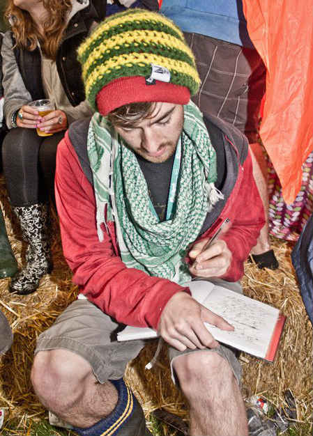 Tom writing at festival