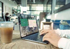 Using a laptop in a cafe