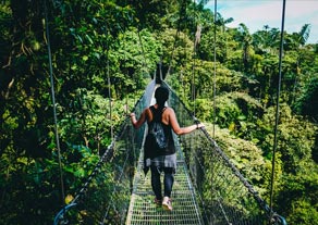 Woman on rope bridge